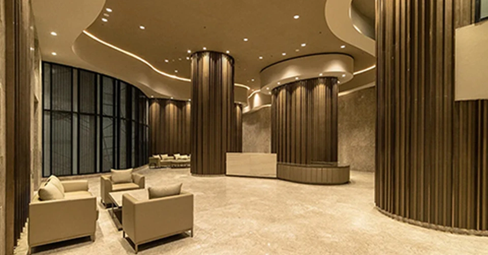 Elegant living room with blue ottoman