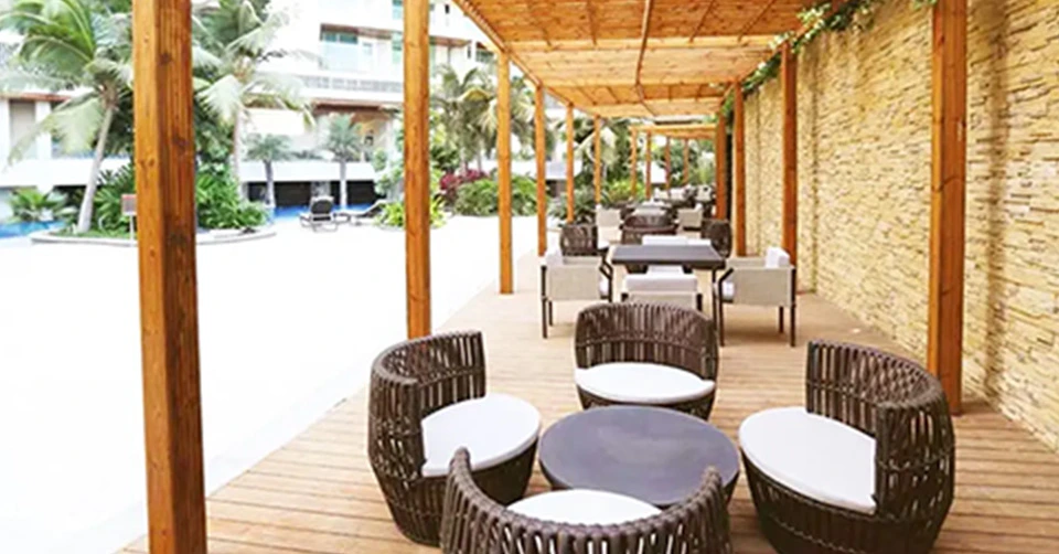 Living room with orange sofa and wooden partition
