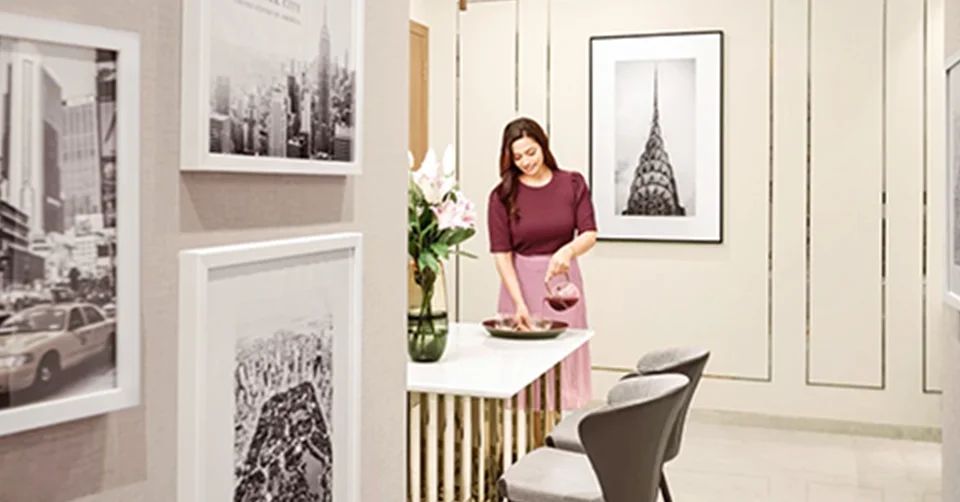 Elegant living room with blue ottoman
